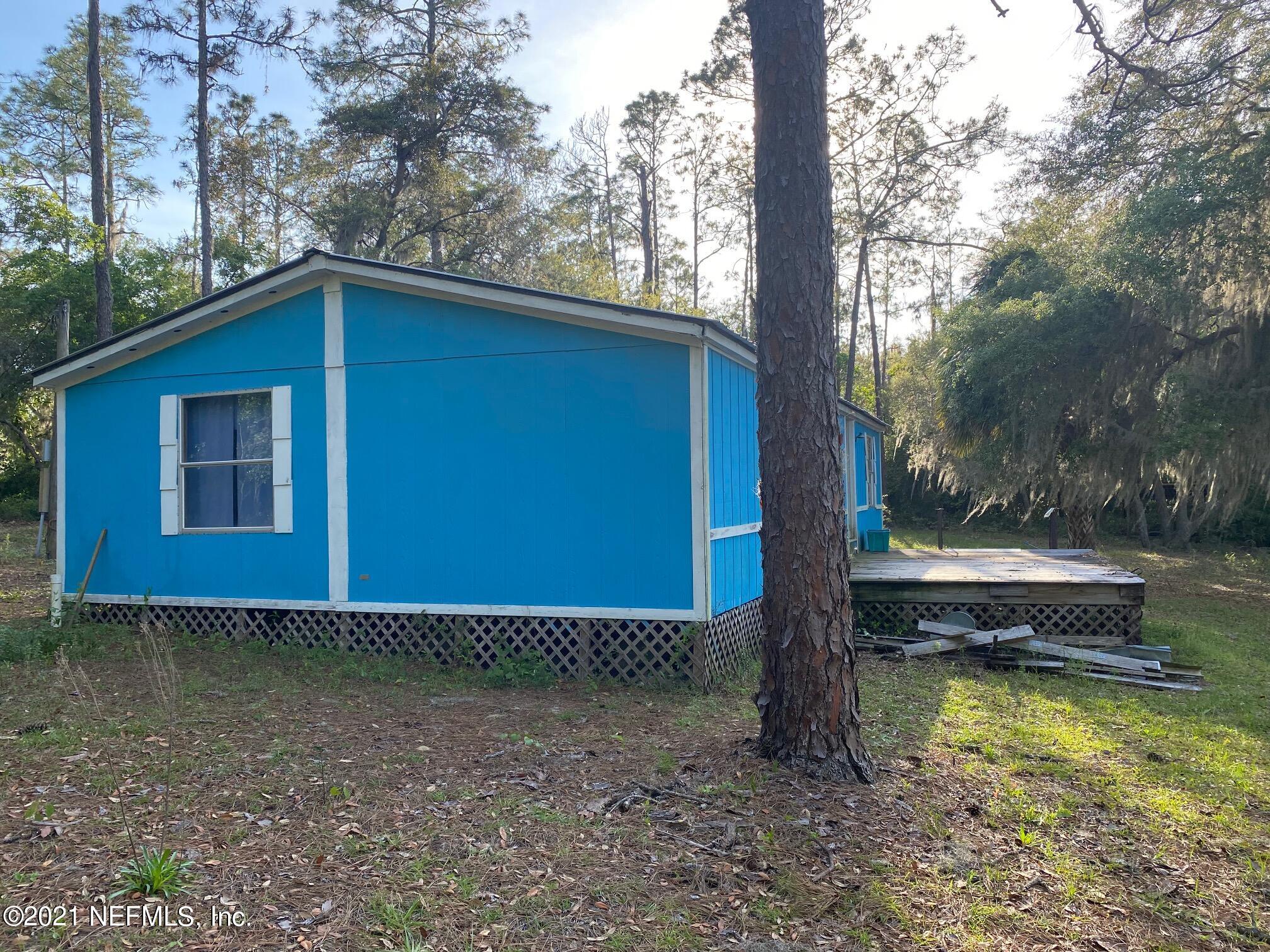 196 Indian Lakes Road Hawthorne, FL 32640 - Photo 7 of 27 a view of a house with a yard