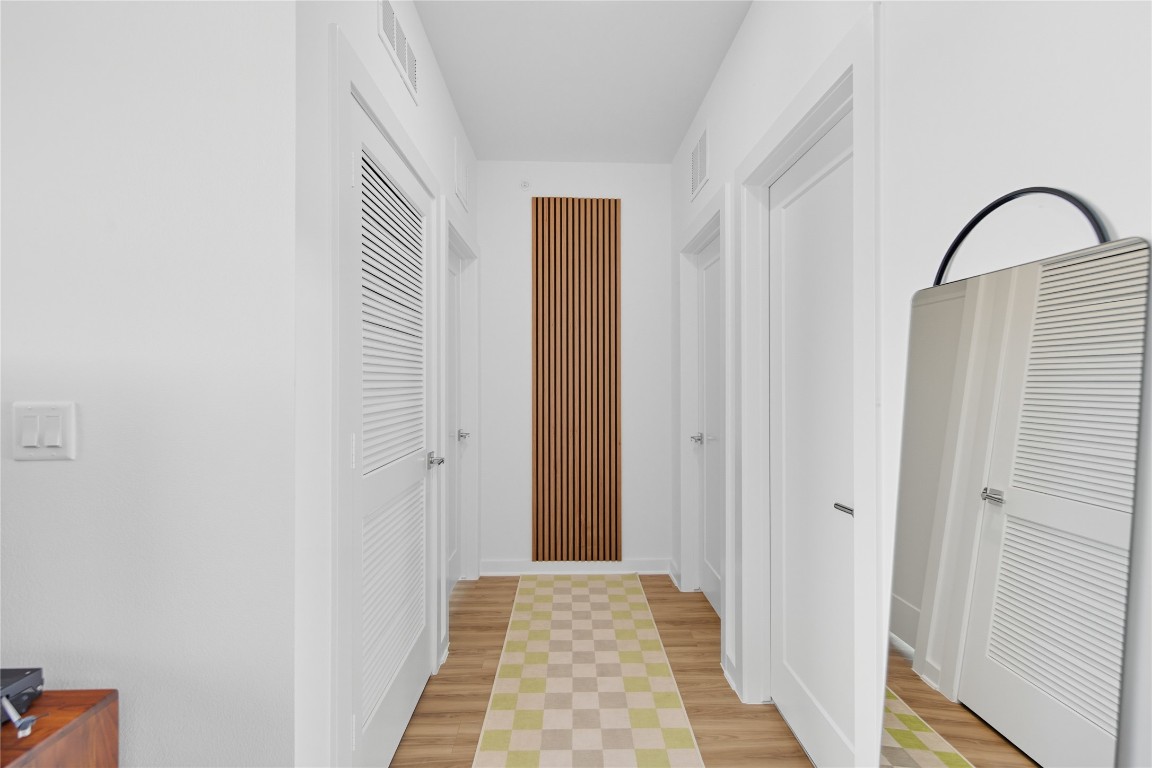 4802 South Congress Avenue, Unit 507 Austin, TX 78745 - Photo 15 of 30 Hallway featuring light wood-type flooring