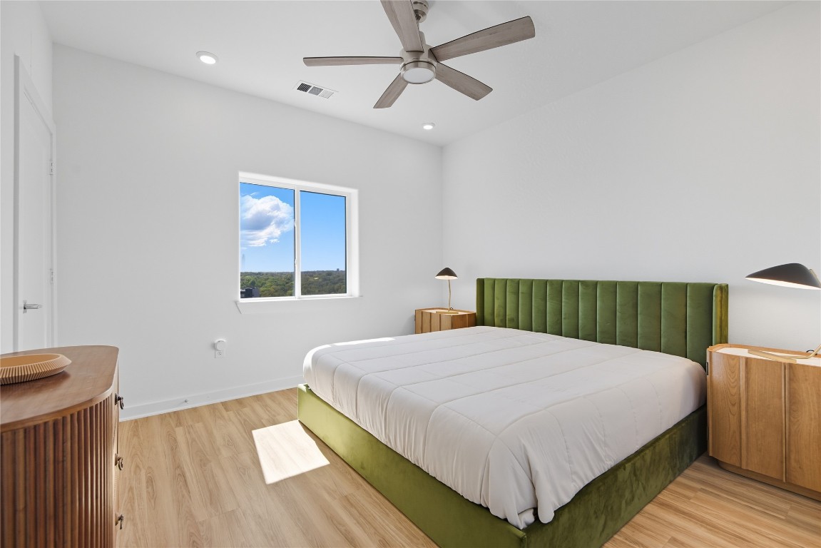 4802 South Congress Avenue, Unit 507 Austin, TX 78745 - Photo 19 of 30 Bedroom with ceiling fan, light wood finished floors, and recessed lighting