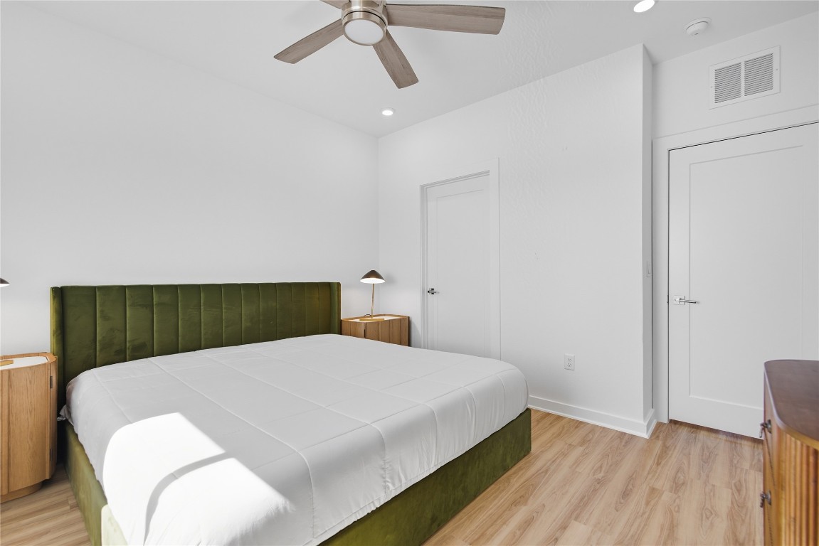 4802 South Congress Avenue, Unit 507 Austin, TX 78745 - Photo 20 of 30 Bedroom with light wood-style flooring, a ceiling fan, and recessed lighting