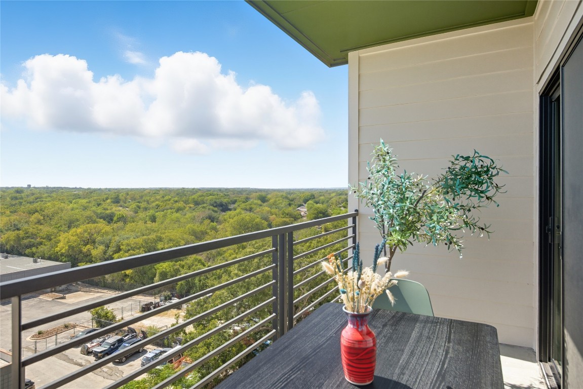 4802 South Congress Avenue, Unit 507 Austin, TX 78745 - Photo 25 of 30 Balcony featuring a wooded view