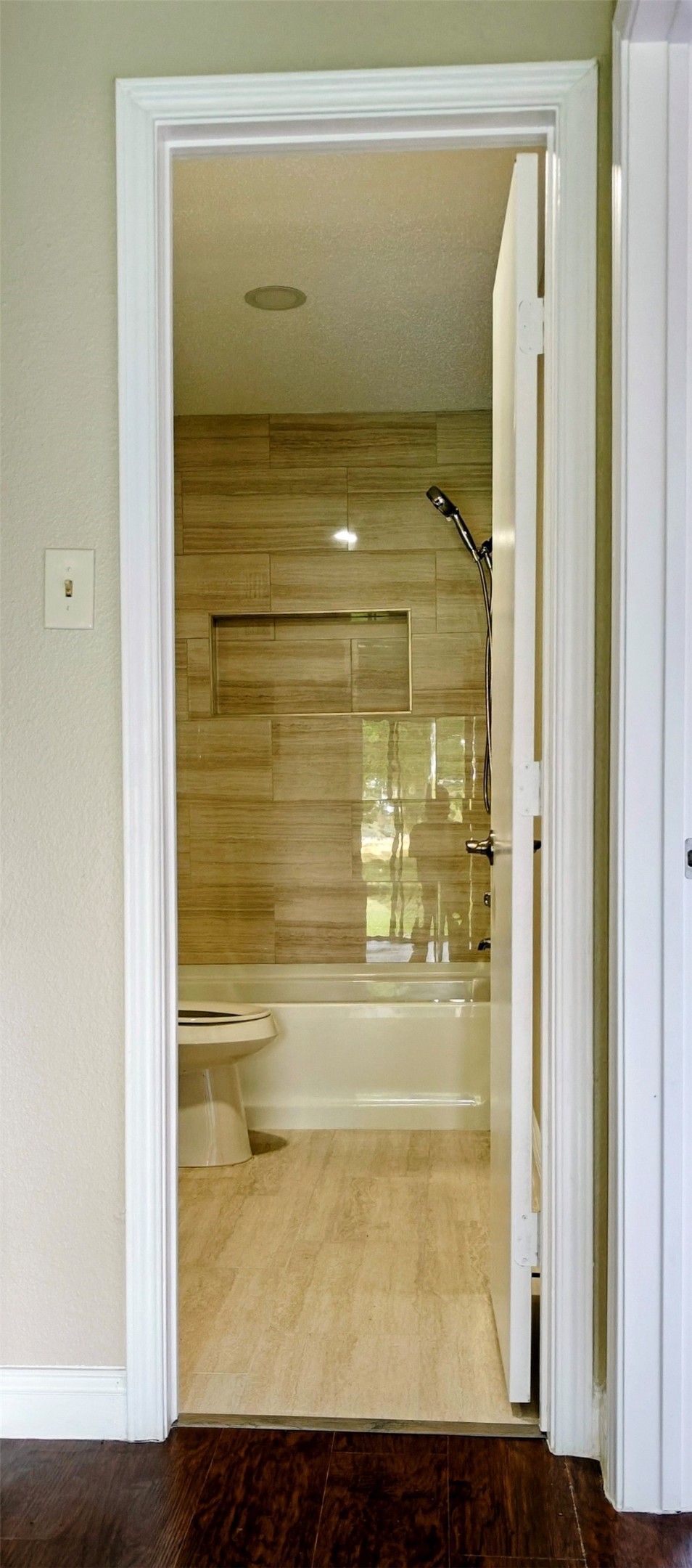 8413 Sands Point Drive Houston, TX 77036 - Photo 15 of 23 a bathroom with a glass shower door