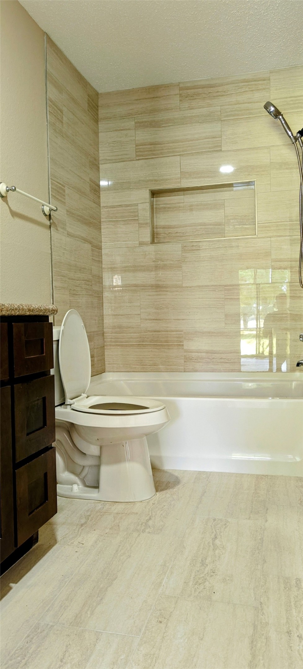 8413 Sands Point Drive Houston, TX 77036 - Photo 16 of 23 a bathroom with a toilet and a shower