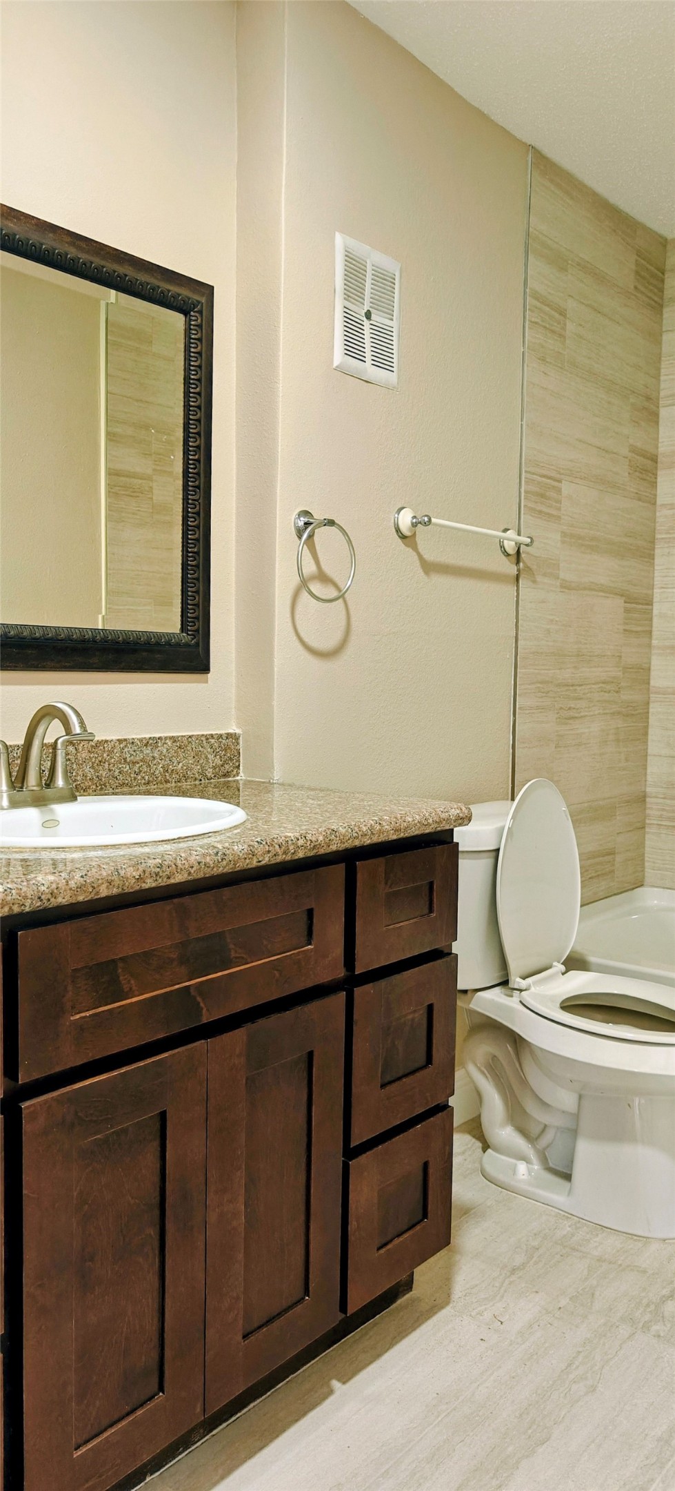 8413 Sands Point Drive Houston, TX 77036 - Photo 17 of 23 a bathroom with a sink a mirror and vanity