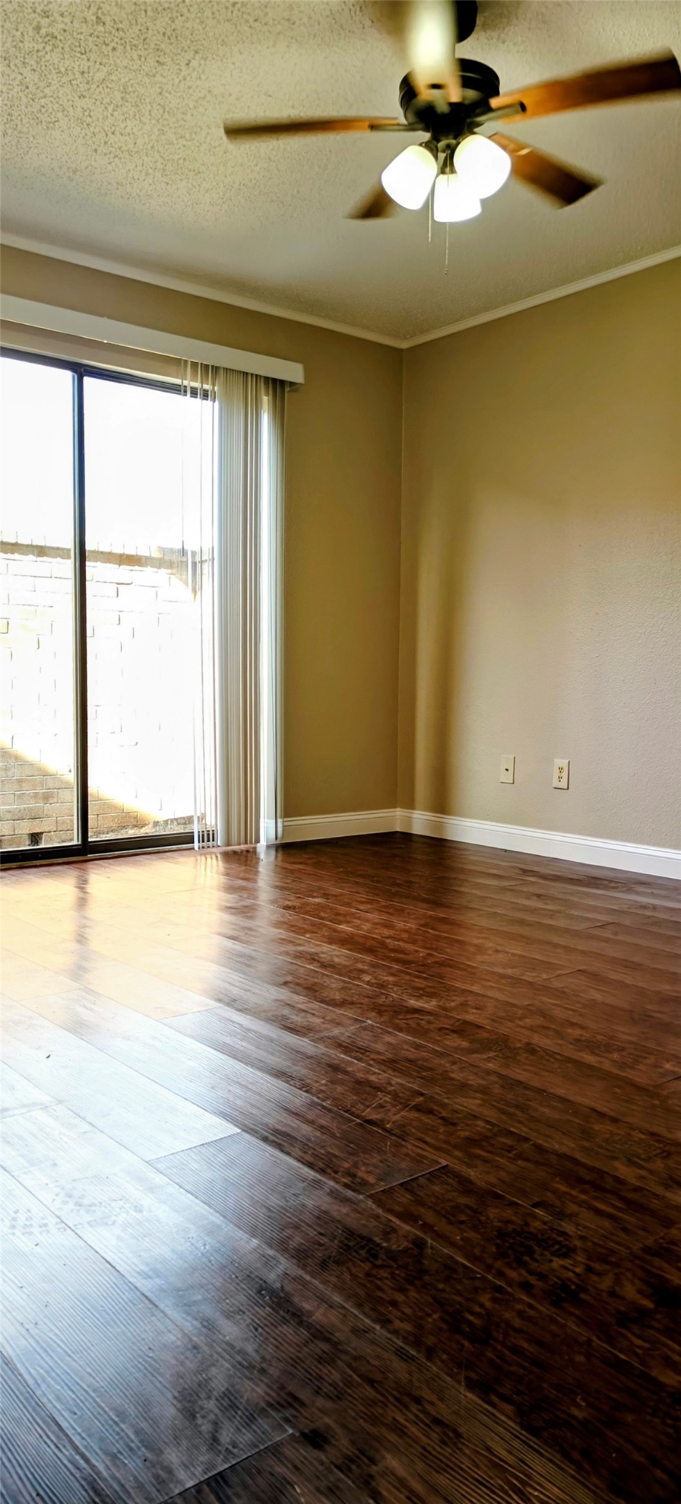 8413 Sands Point Drive Houston, TX 77036 - Photo 21 of 23 a view of a room with wooden floor and a window