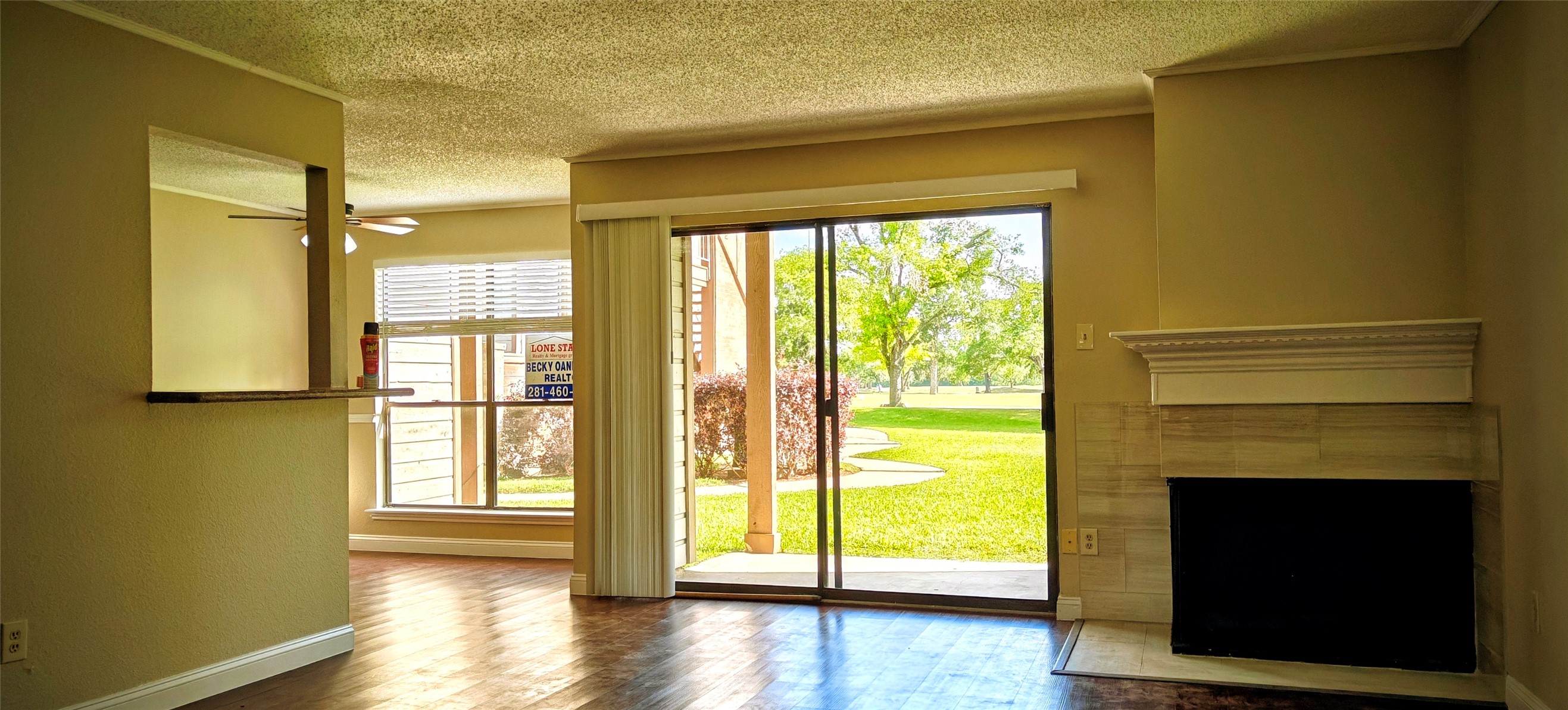 8413 Sands Point Drive Houston, TX 77036 - Photo 4 of 23 a view of an empty room with wooden floor and a window