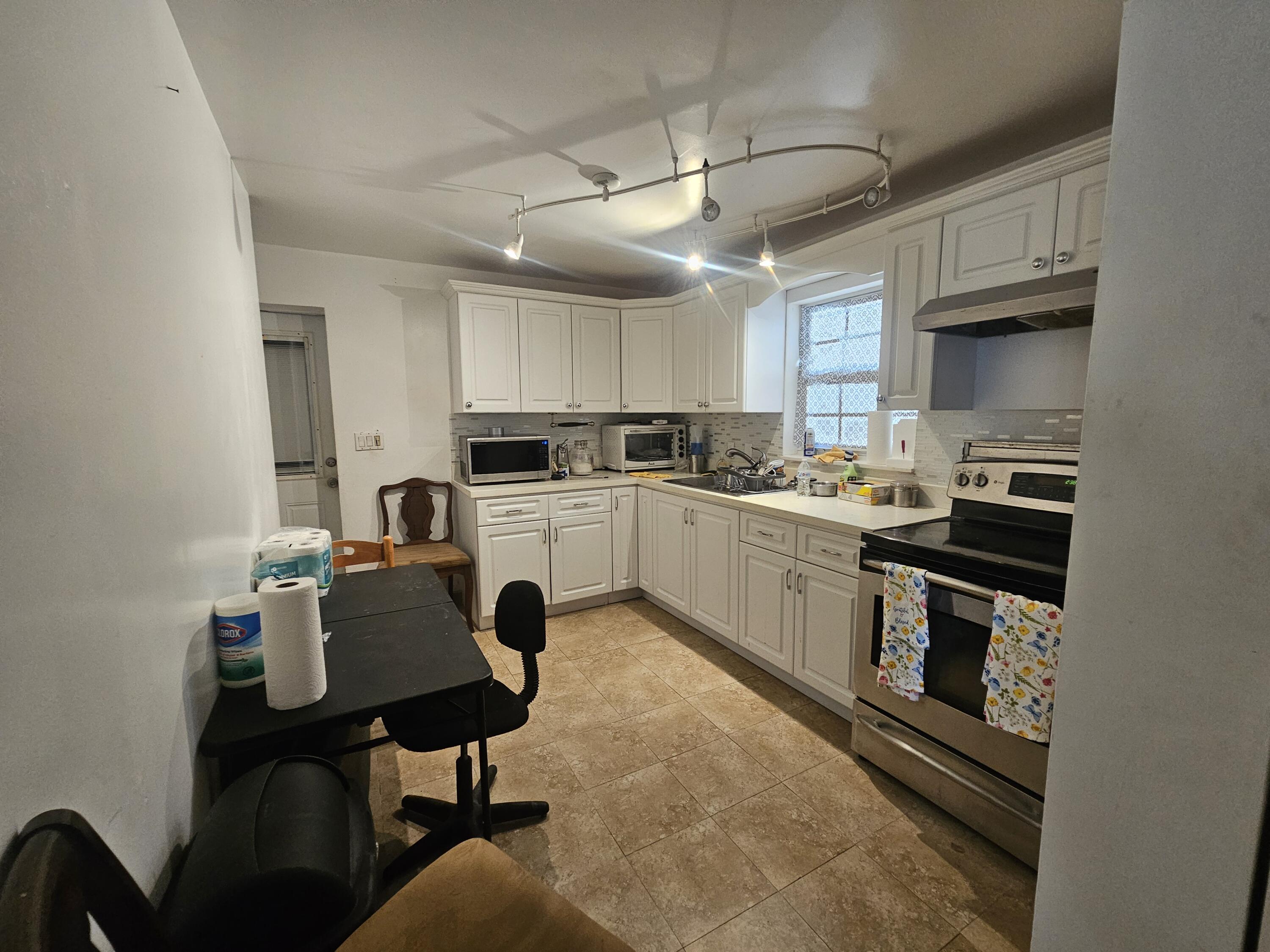 174 Corrine Place Key Largo, FL 33037 - Photo 12 of 28 a kitchen with a sink cabinets and window