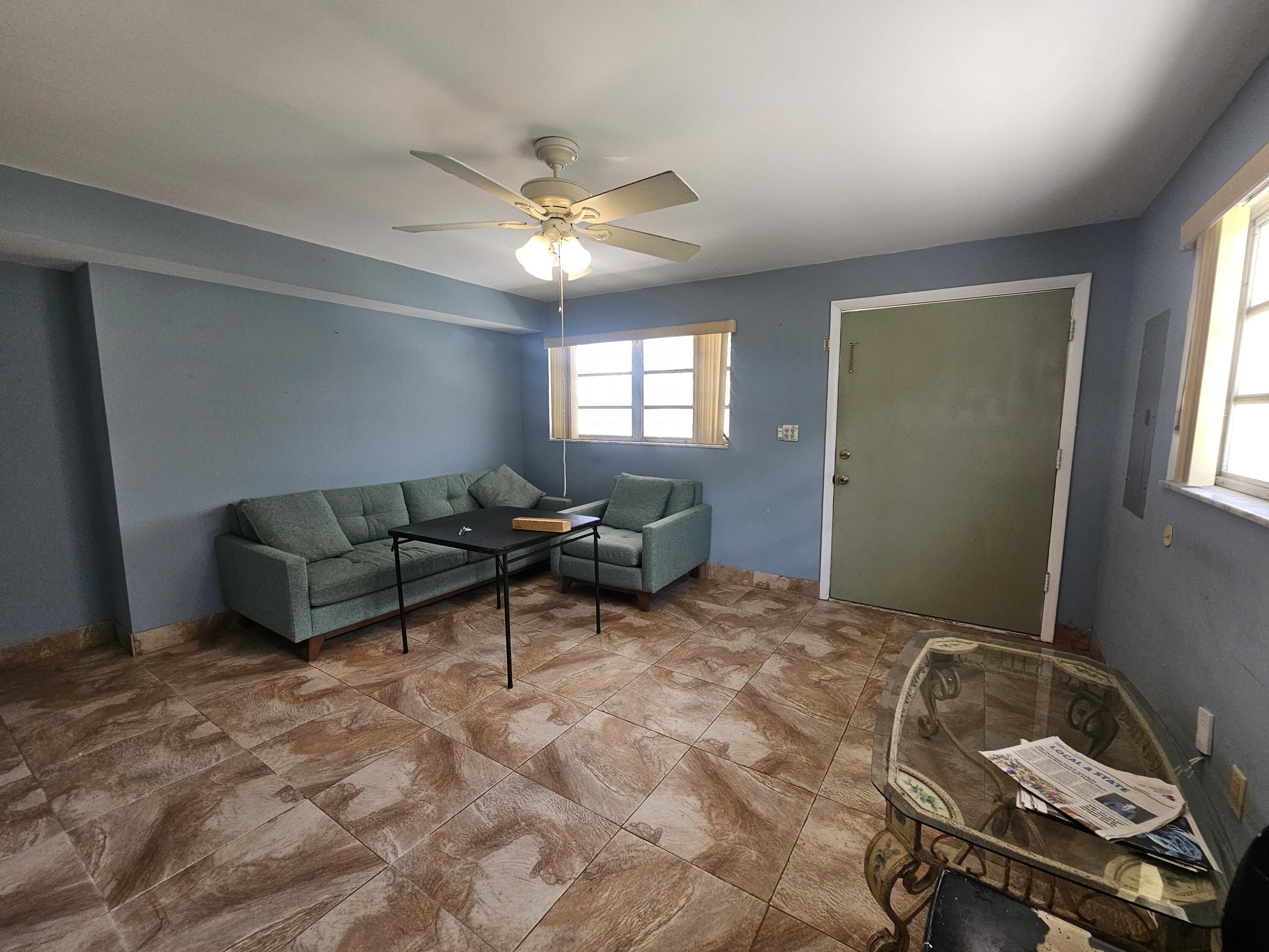 174 Corrine Place Key Largo, FL 33037 - Photo 13 of 28 a living room with furniture and a chandelier