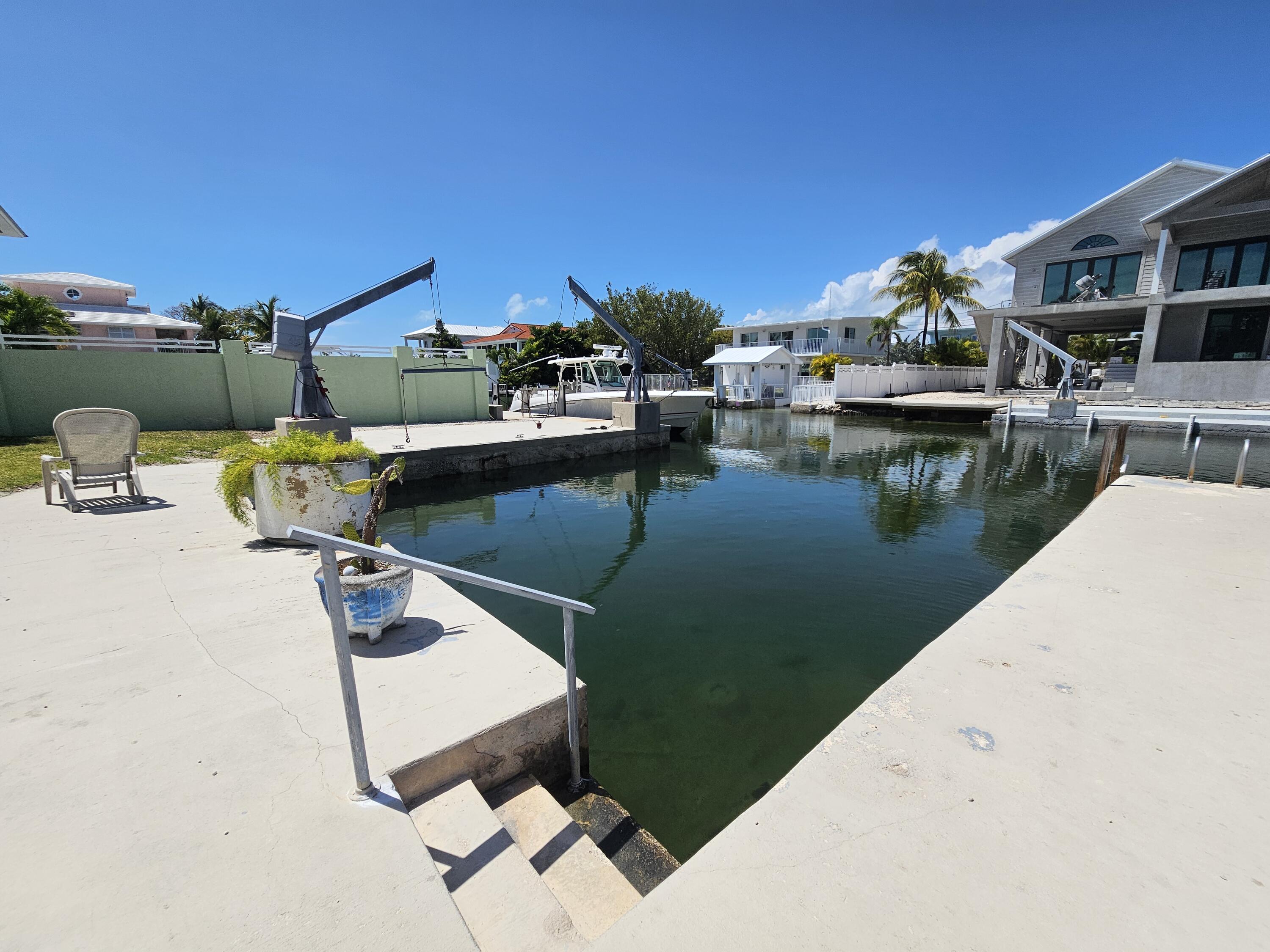 174 Corrine Place Key Largo, FL 33037 - Photo 15 of 28 a view of a lake with a house