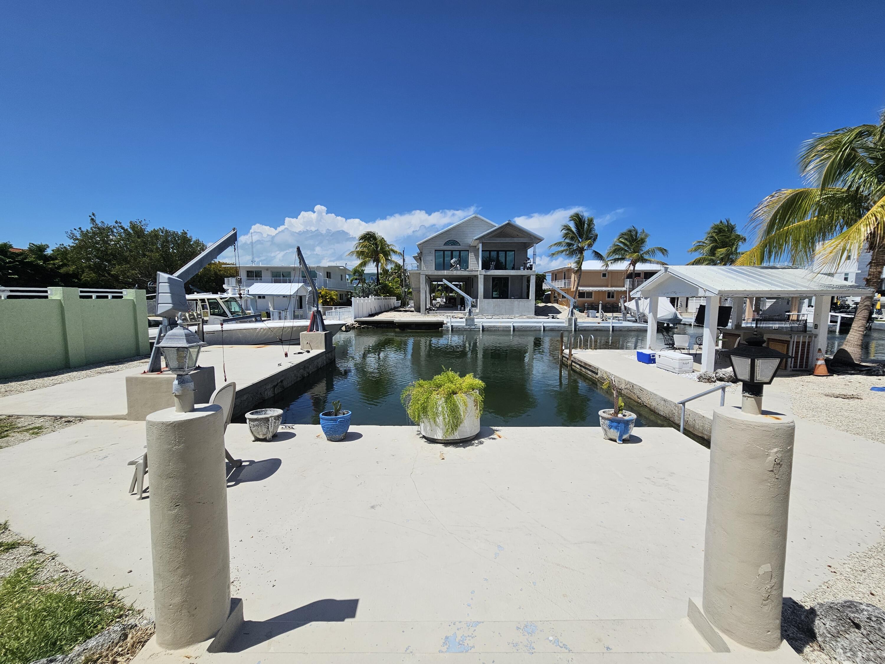 174 Corrine Place Key Largo, FL 33037 - Photo 20 of 28 a view of a swimming pool with outdoor seating