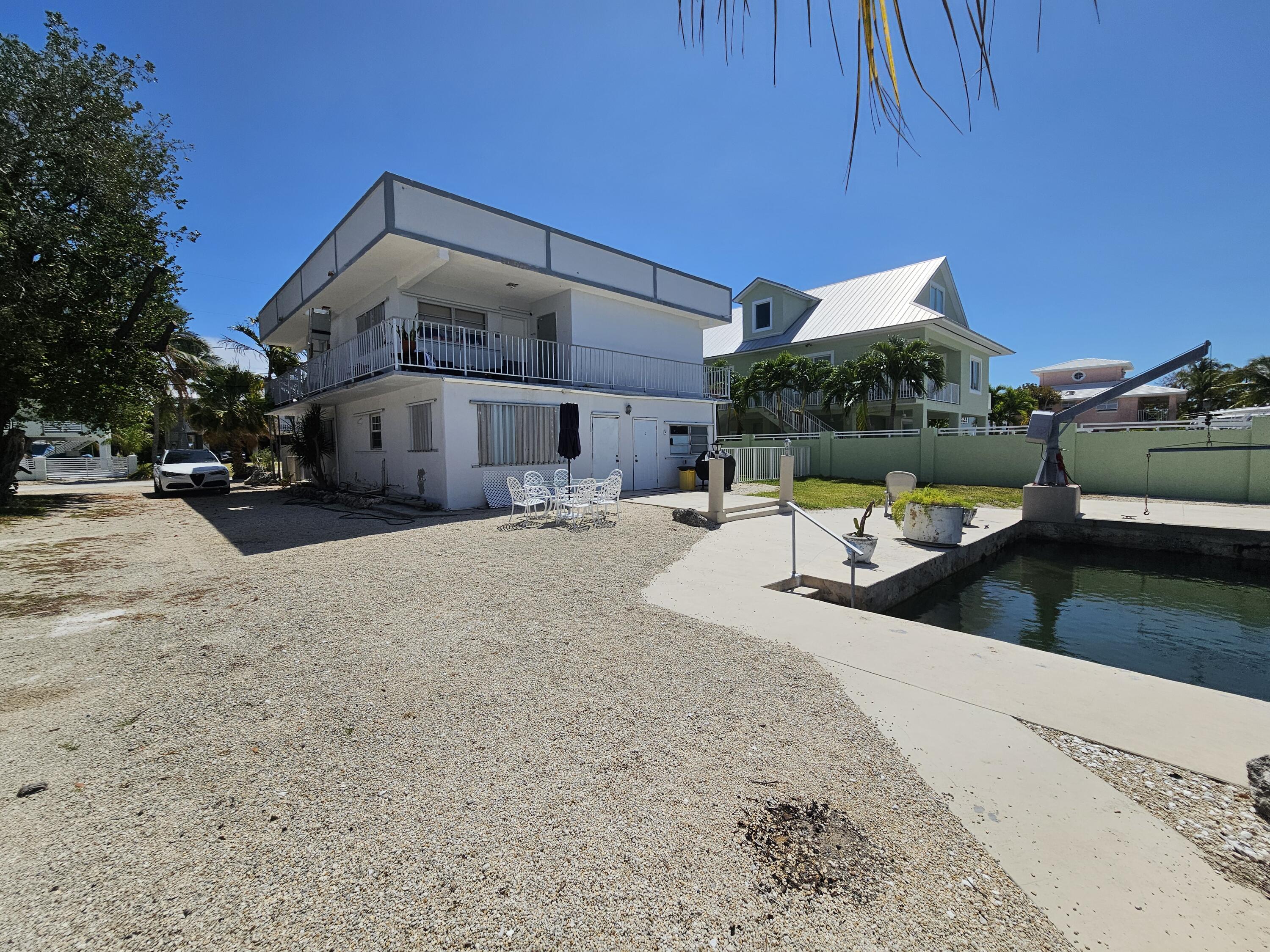 174 Corrine Place Key Largo, FL 33037 - Photo 24 of 28 a view of a house with a patio