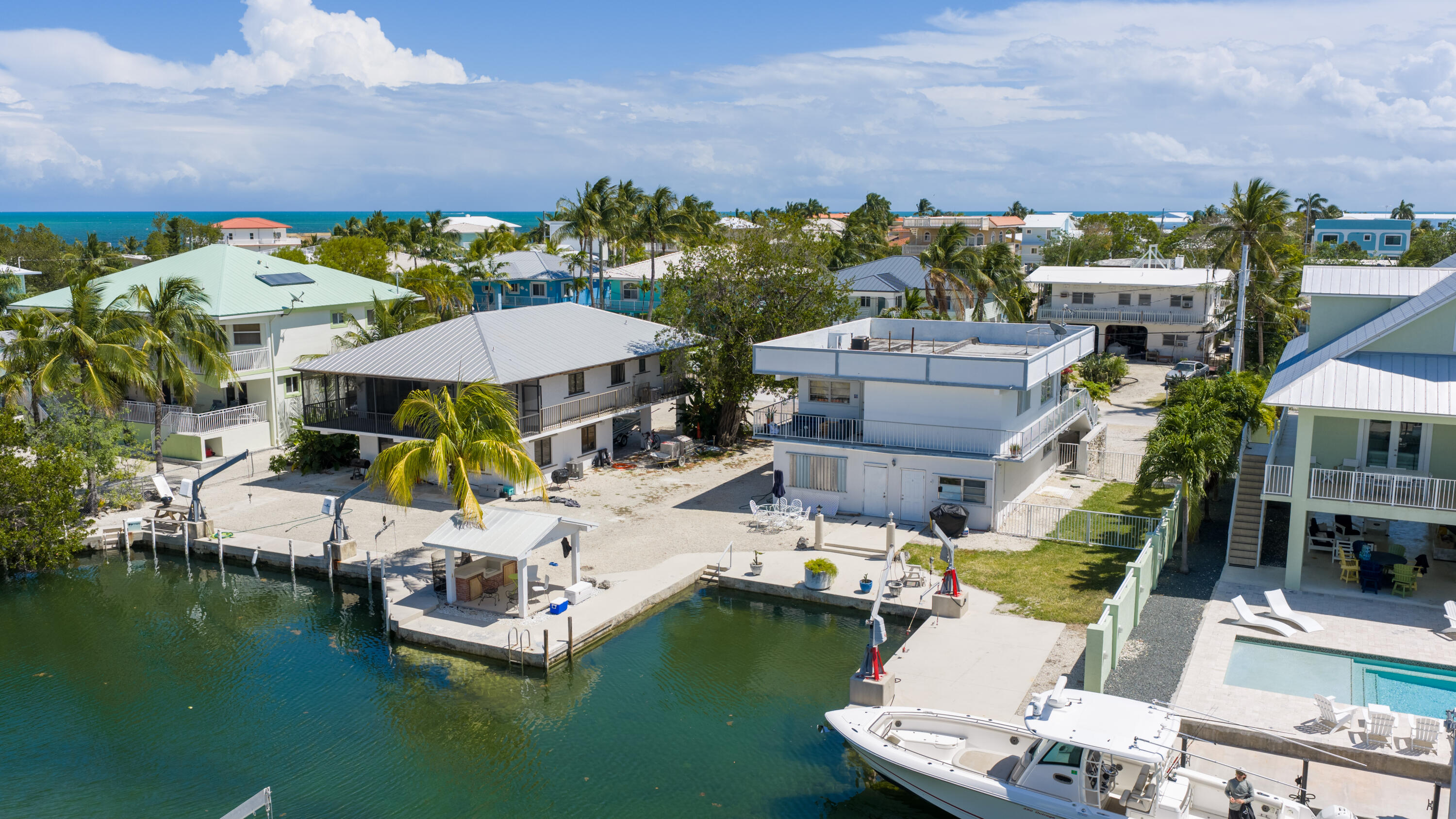 174 Corrine Place Key Largo, FL 33037 - Photo 3 of 28 a aerial view of a swimming pool with outdoor seating