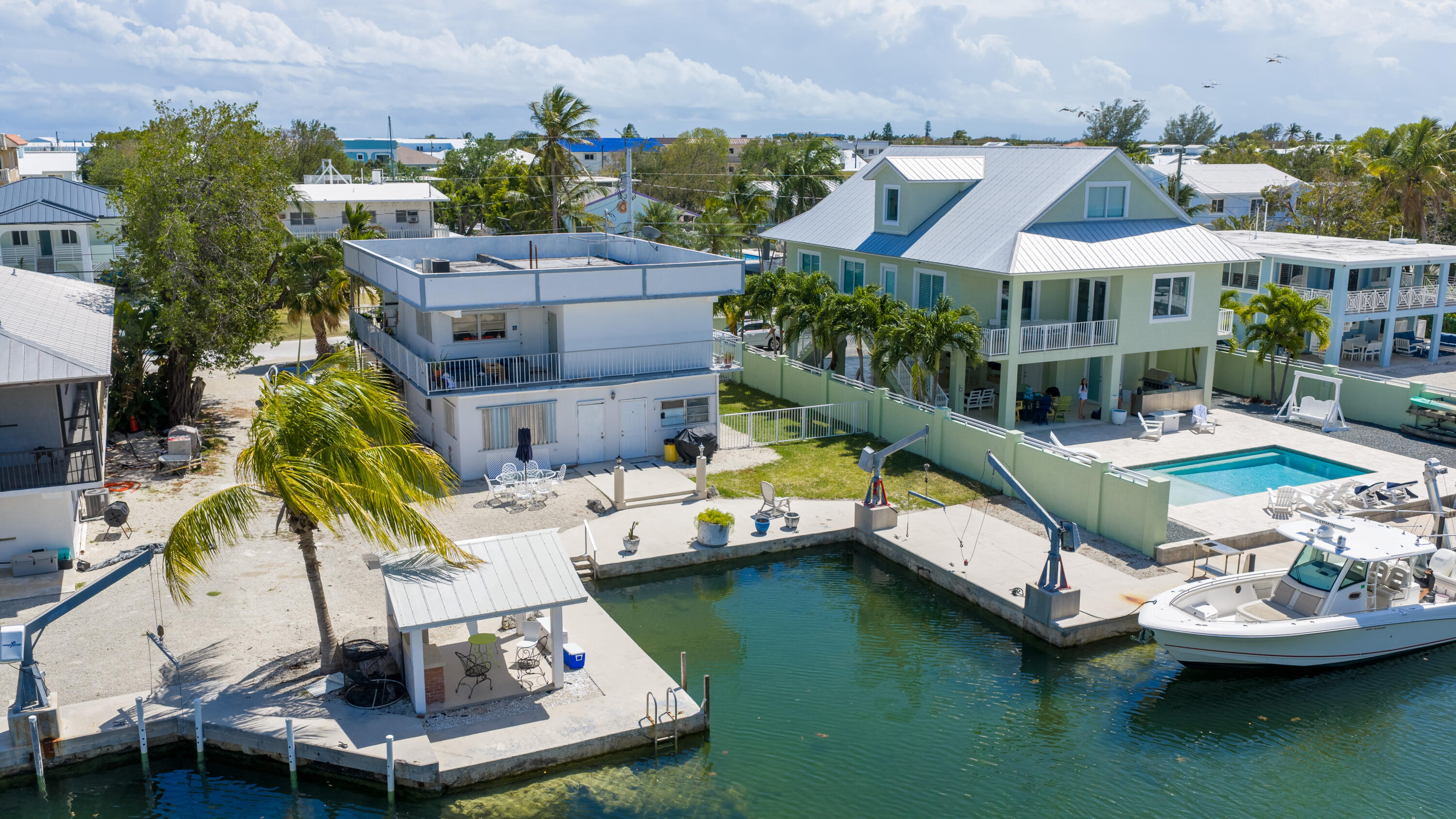 174 Corrine Place Key Largo, FL 33037 - Photo 4 of 28 an aerial view of a house with swimming pool and outdoor seating
