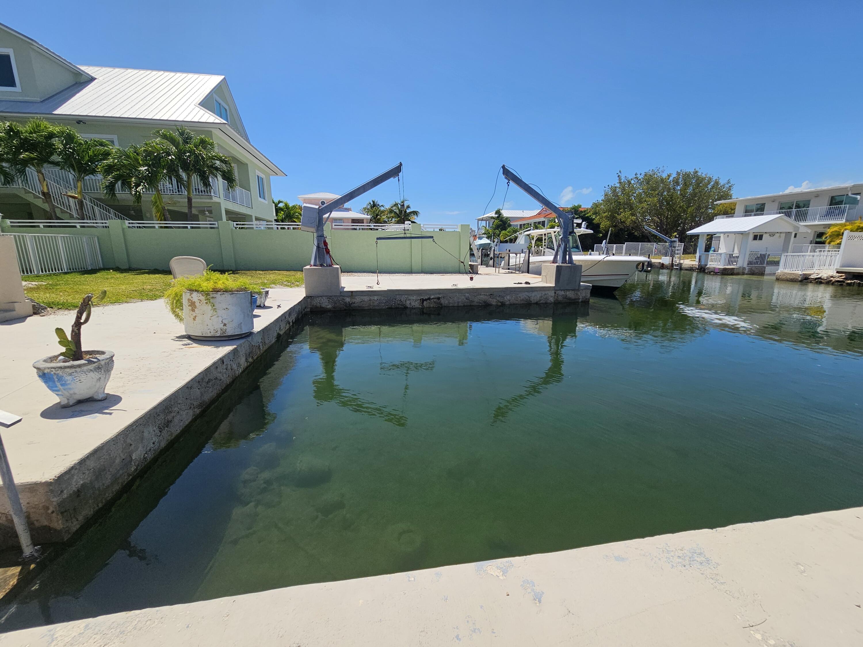 174 Corrine Place Key Largo, FL 33037 - Photo 5 of 28 a swimming pool with outdoor seating and yard