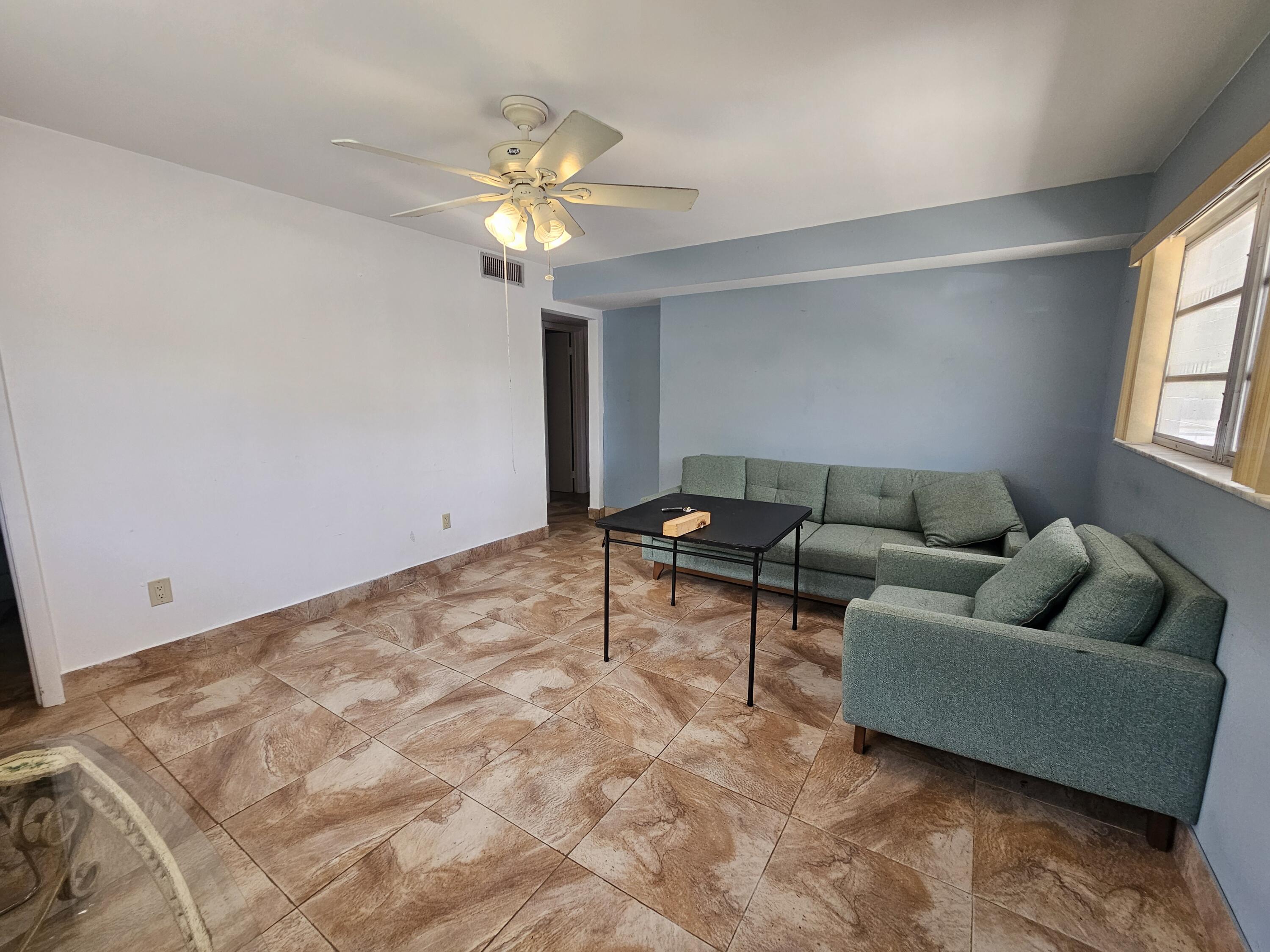 174 Corrine Place Key Largo, FL 33037 - Photo 8 of 28 a living room with furniture and a window