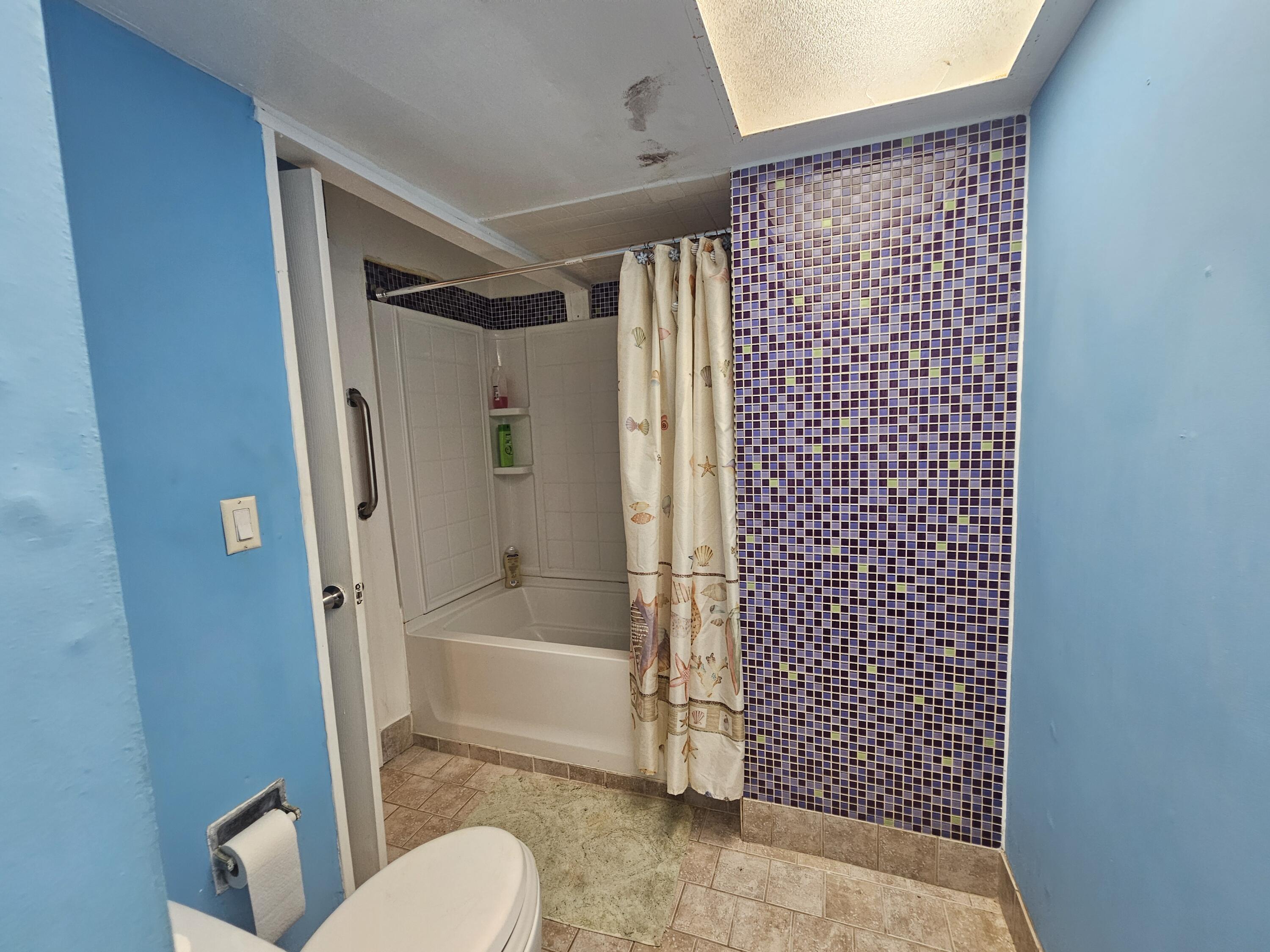 174 Corrine Place Key Largo, FL 33037 - Photo 10 of 28 a bathroom with a shower and a toilet