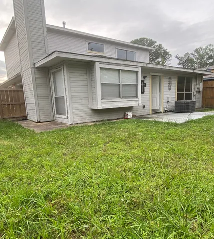 a house view with a garden space