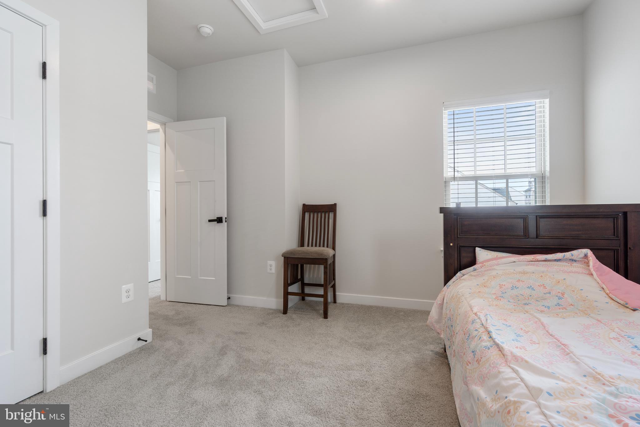 7922 Brandy Station Road Hanover, MD 21076 - Photo 15 of 22 a bedroom with a bed and a window