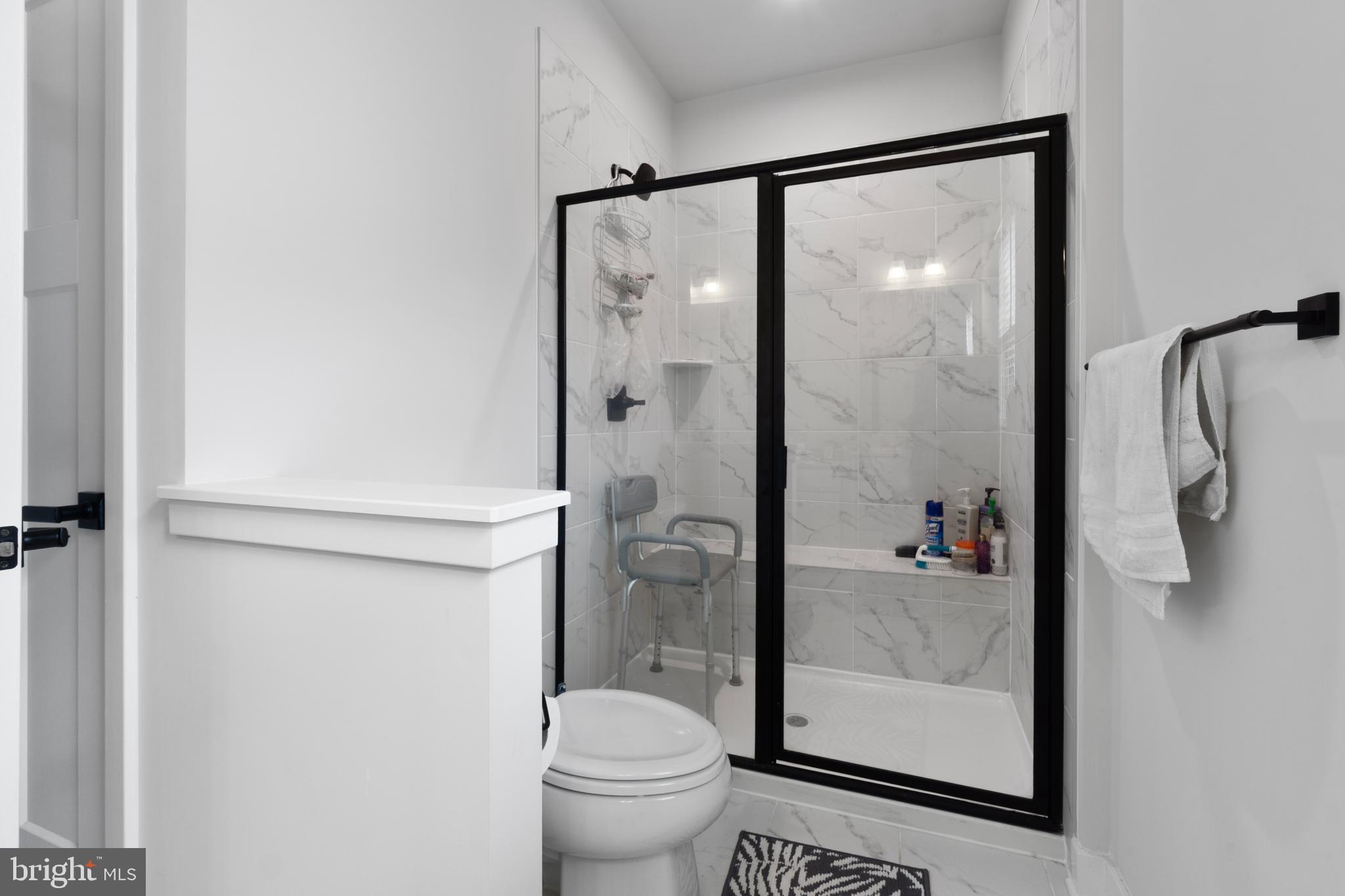 7922 Brandy Station Road Hanover, MD 21076 - Photo 18 of 22 a bathroom with a shower and a toilet