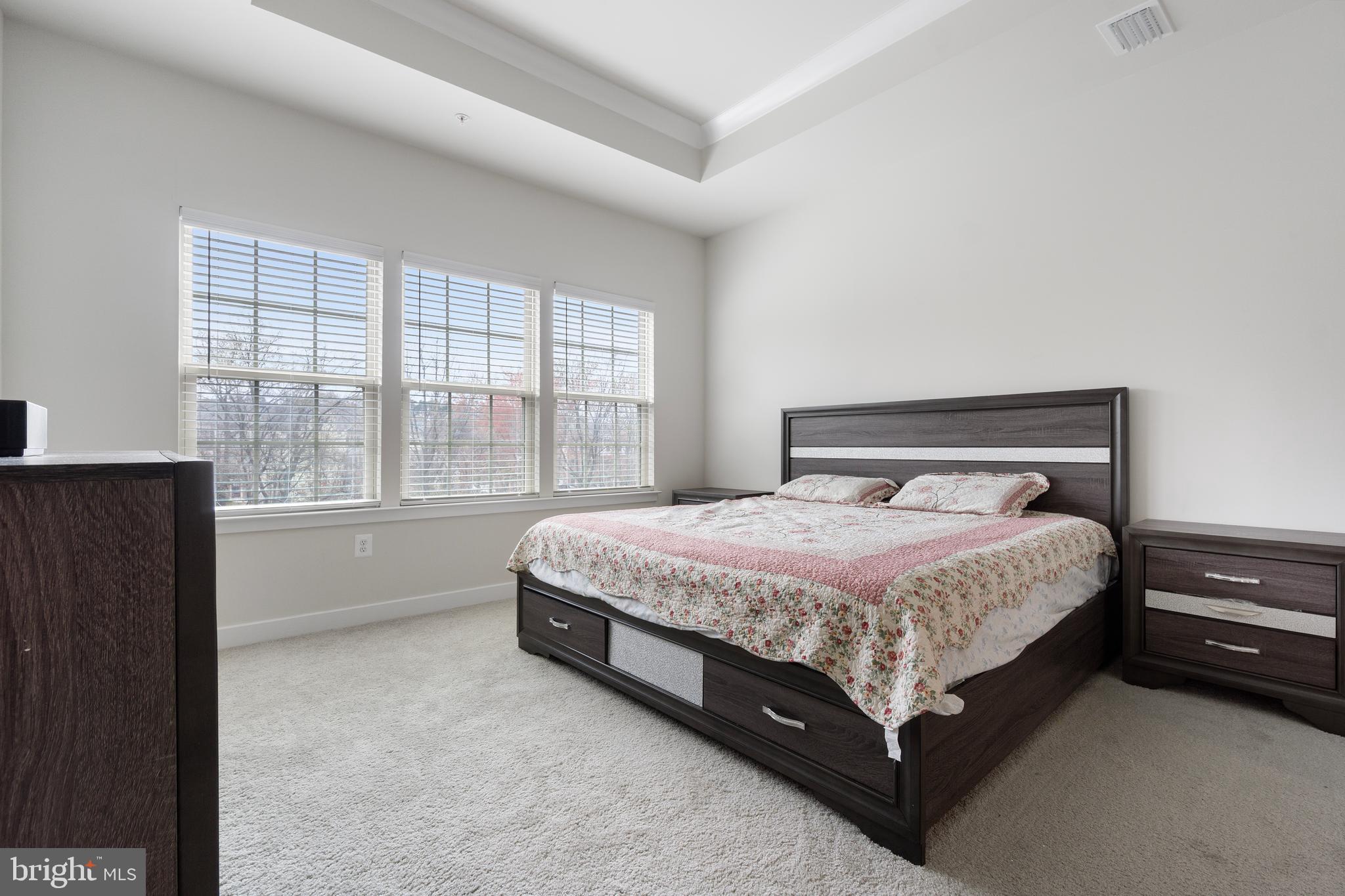 7922 Brandy Station Road Hanover, MD 21076 - Photo 19 of 22 a bed sitting in a bedroom next to a window