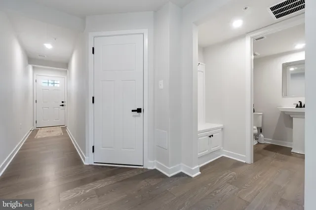 wooden floor with white walls