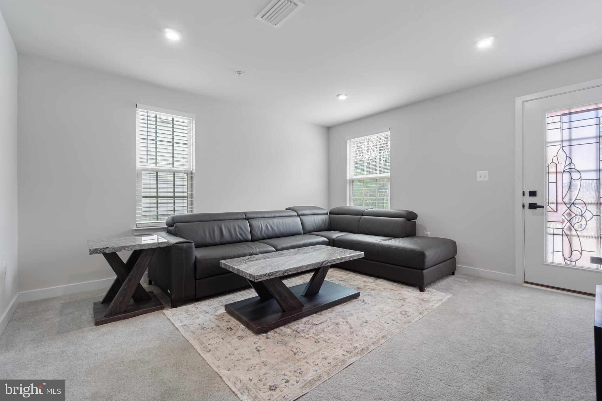 7922 Brandy Station Road Hanover, MD 21076 - Photo 22 of 22 a living room with furniture and windows