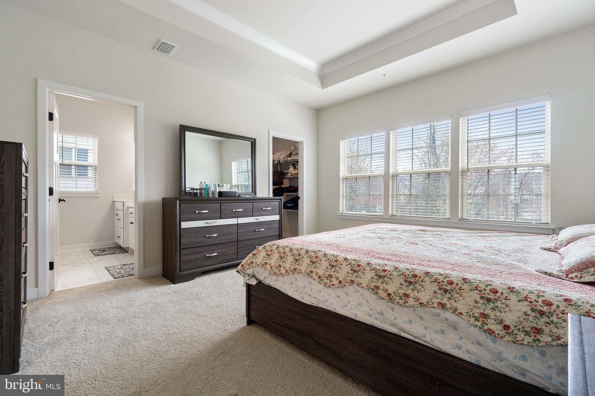 7922 Brandy Station Road Hanover, MD 21076 - Photo 7 of 22 a bedroom with a bed and a dresser