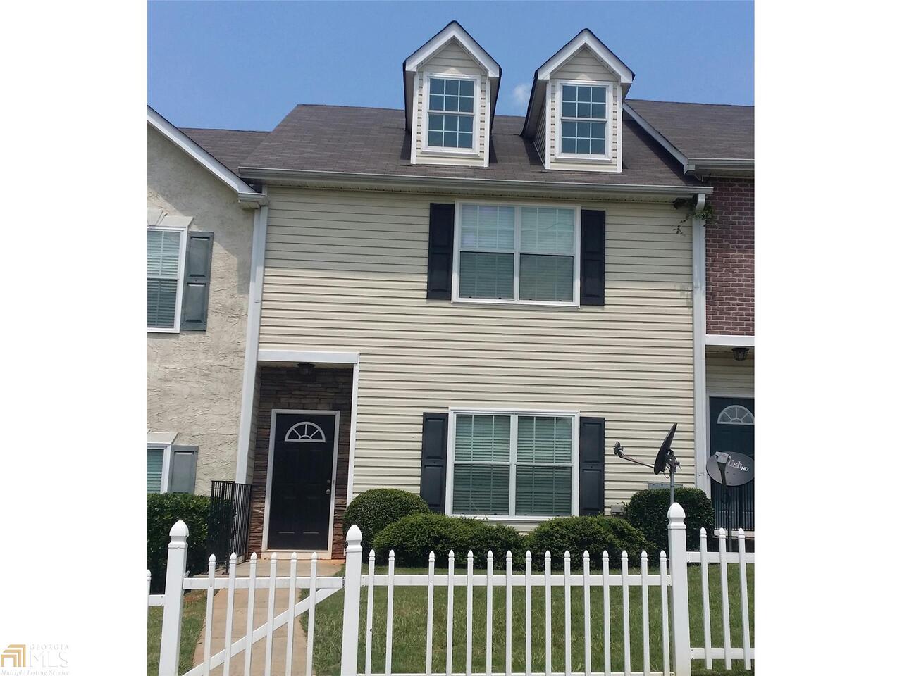 a front view of a house with glass windows