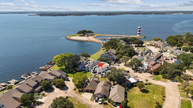 an aerial view of a house with a lake view