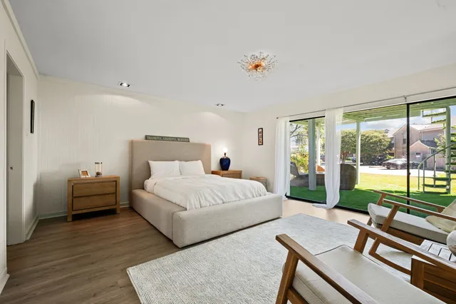 a bedroom with a bed and a chair