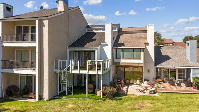 front view of a brick house with a yard