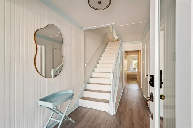 a room with wooden floor and a glass door