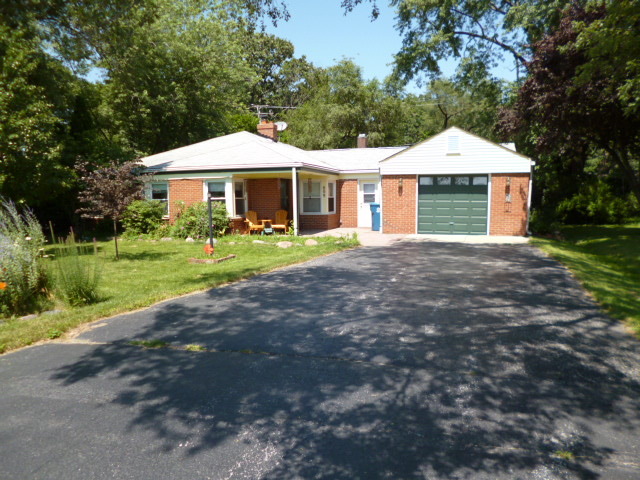 809 St Andrews Drive Crete, IL 60417 - Photo 1 of 24 a front view of a house with a yard