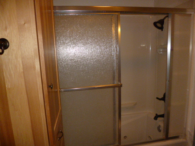 809 St Andrews Drive Crete, IL 60417 - Photo 11 of 24 a bathroom with a glass shower door