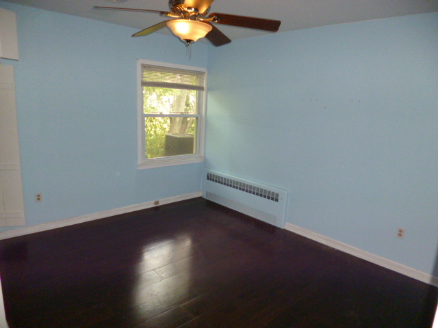 809 St Andrews Drive Crete, IL 60417 - Photo 19 of 24 a view of a livingroom with wooden floor and a window