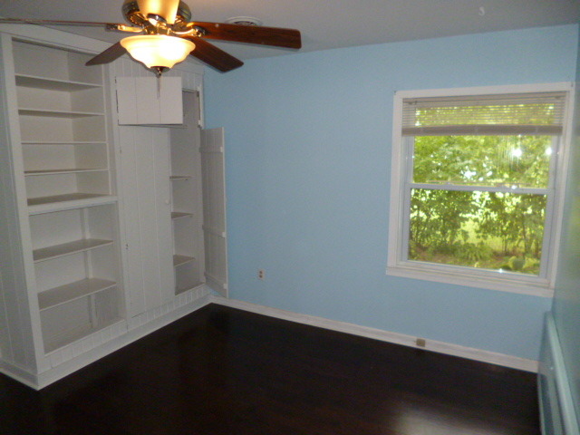809 St Andrews Drive Crete, IL 60417 - Photo 20 of 24 a view of a small space with wooden floor and a window
