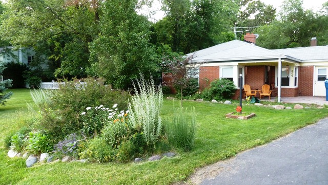 809 St Andrews Drive Crete, IL 60417 - Photo 23 of 24 a front view of a house with a yard table and chairs