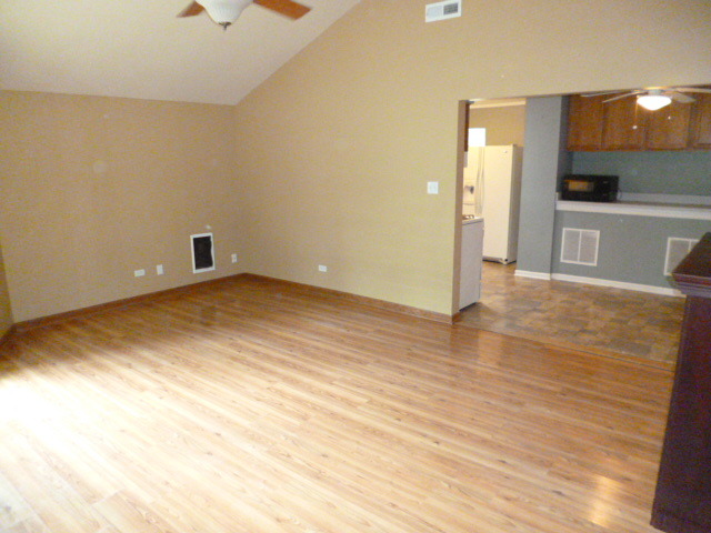 809 St Andrews Drive Crete, IL 60417 - Photo 3 of 24 a view of a room with wooden floor and a sink
