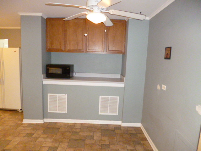 809 St Andrews Drive Crete, IL 60417 - Photo 8 of 24 a kitchen with stainless steel appliances granite countertop a sink a stove and a microwave