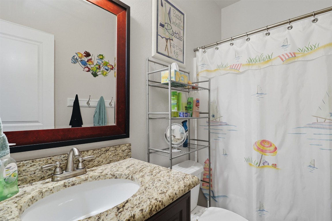 113 Rio Vista Road Burnet, TX 78611 - Photo 16 of 28 Bathroom with vanity and a shower with curtain