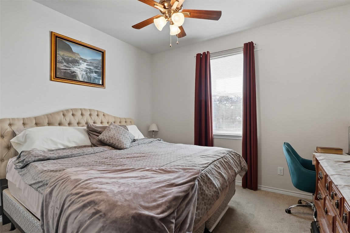 113 Rio Vista Road Burnet, TX 78611 - Photo 17 of 28 Bedroom with light colored carpet, an office area, and ceiling fan