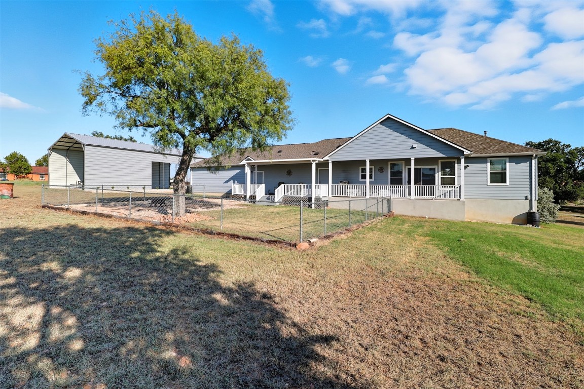 113 Rio Vista Road Burnet, TX 78611 - Photo 22 of 28 Back of house with a porch and a shingled roof