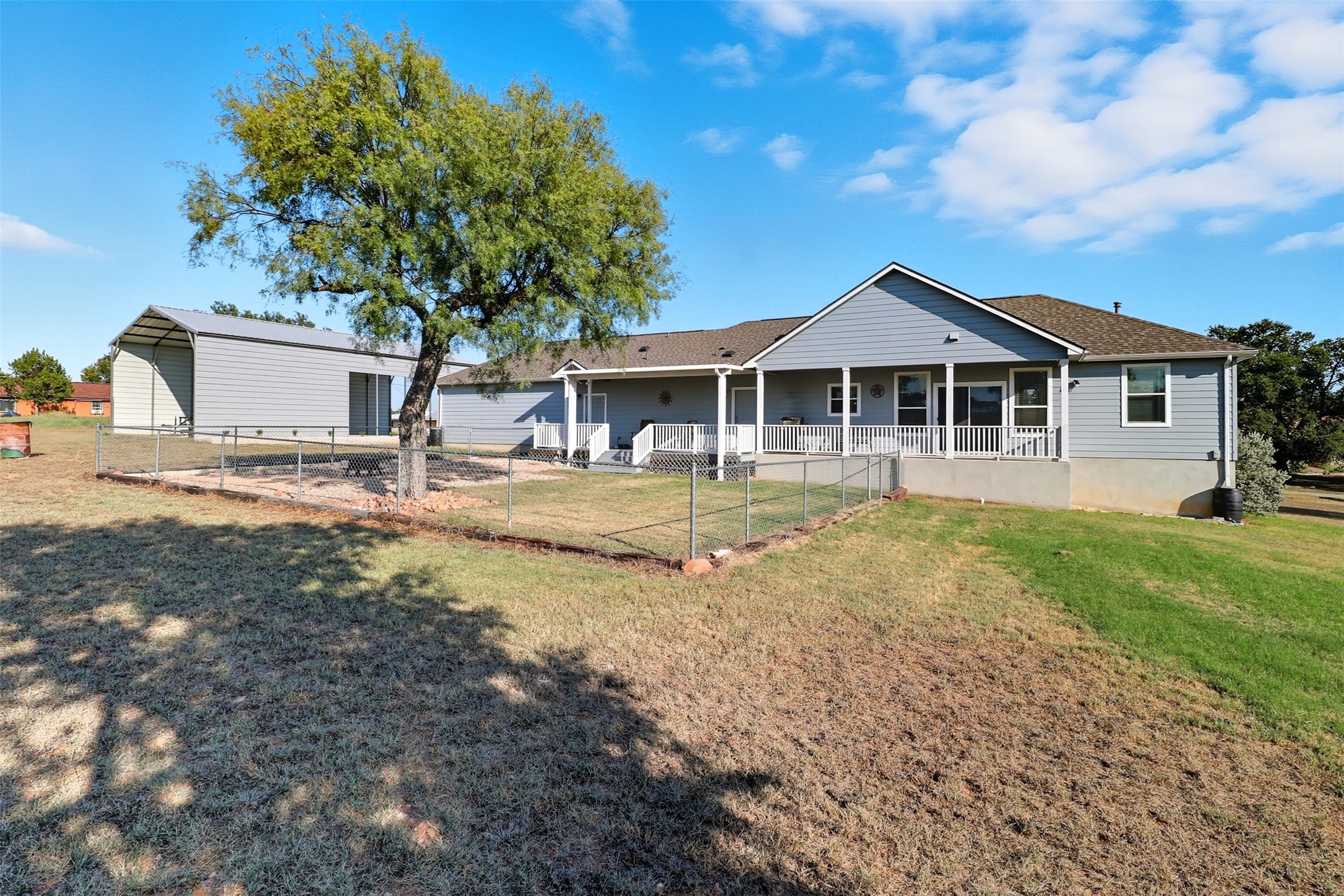 113 Rio Vista Road Burnet, TX 78611 - Photo 22 of 28 Back of house with a porch and a shingled roof