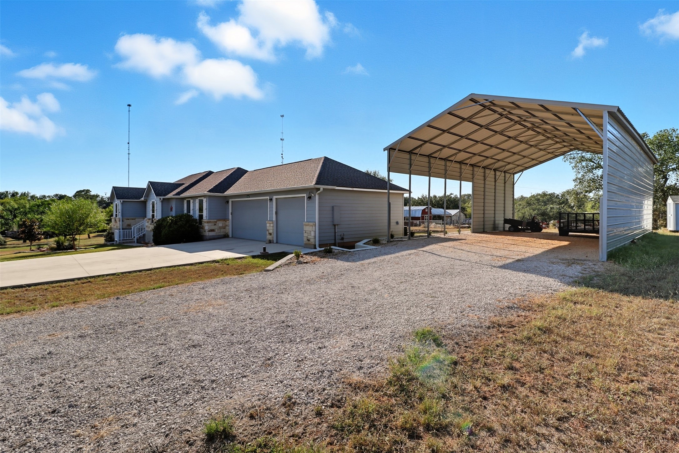 113 Rio Vista Road Burnet, TX 78611 - Photo 5 of 28 View of front of house featuring concrete driveway and a detached carport