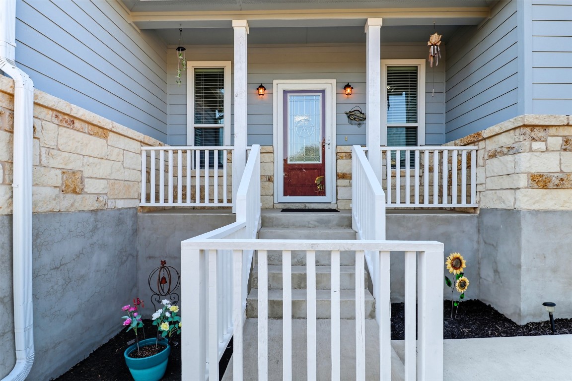 113 Rio Vista Road Burnet, TX 78611 - Photo 6 of 28 View of exterior entry featuring covered porch and stone siding