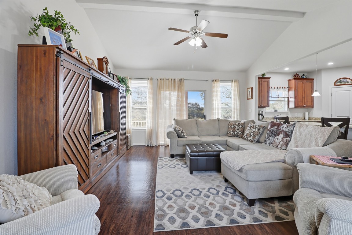 113 Rio Vista Road Burnet, TX 78611 - Photo 7 of 28 Living room with beamed ceiling, healthy amount of natural light, ceiling fan, wood finished floors, and high vaulted ceiling
