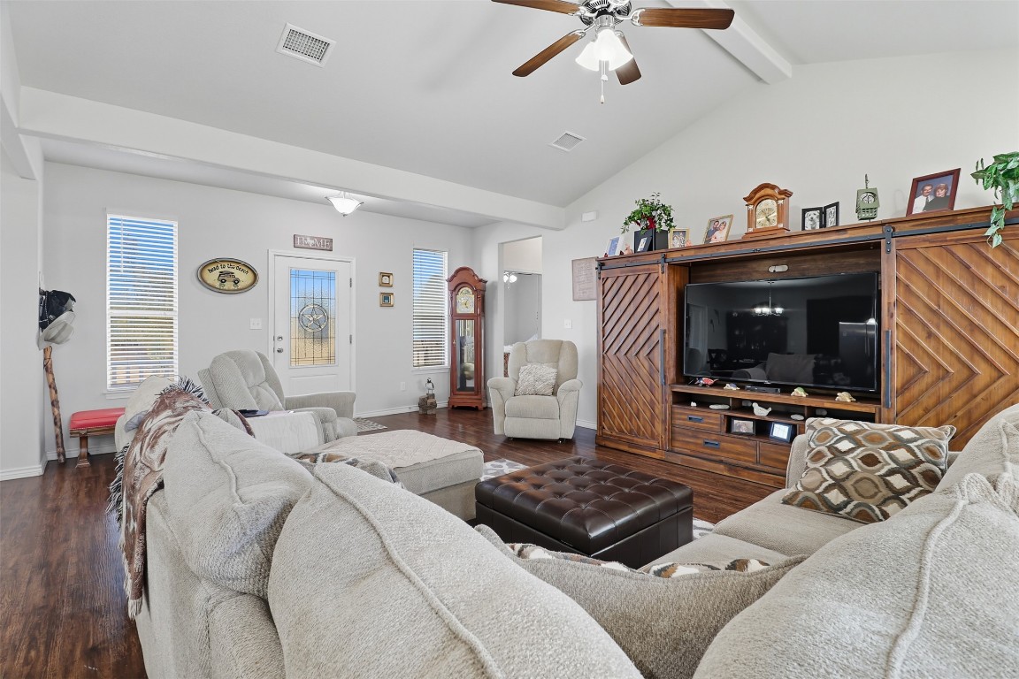 113 Rio Vista Road Burnet, TX 78611 - Photo 8 of 28 Living room with dark wood finished floors, ceiling fan, and plenty of natural light