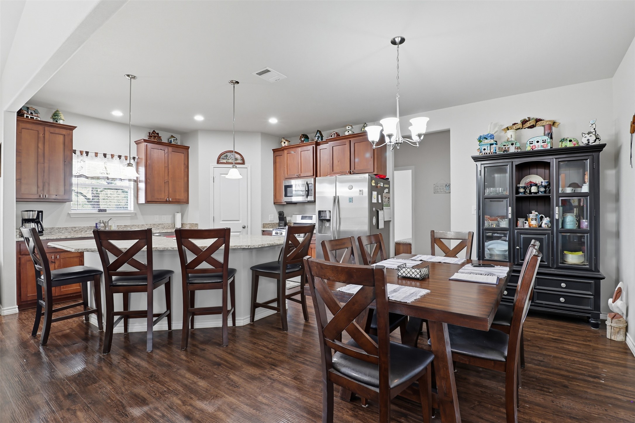 113 Rio Vista Road Burnet, TX 78611 - Photo 9 of 28 Dining area featuring dark wood-type flooring, a chandelier, and recessed lighting