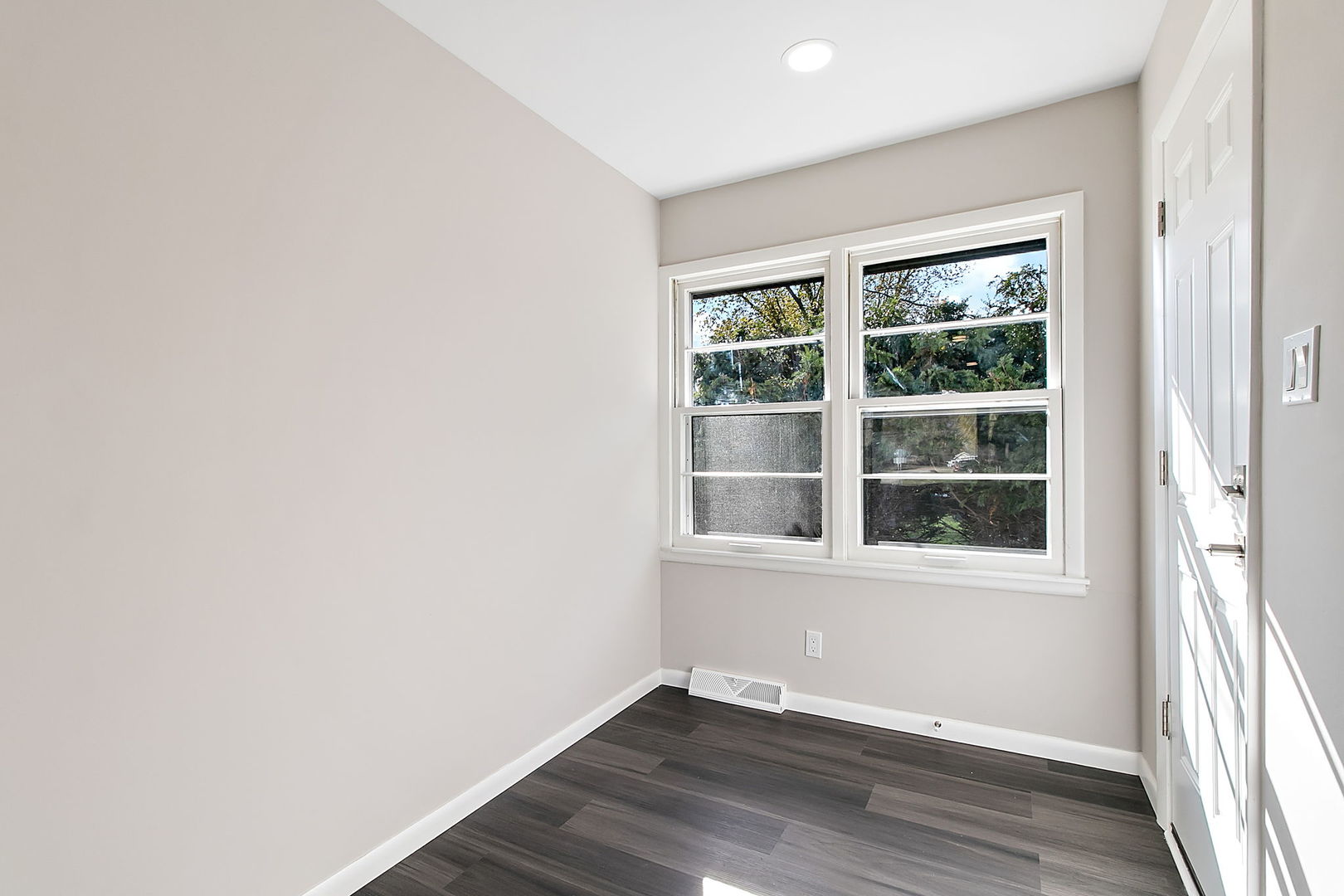 23519 West Renwick Road Plainfield, IL 60586 - Photo 14 of 22 an empty room with wooden floor and windows
