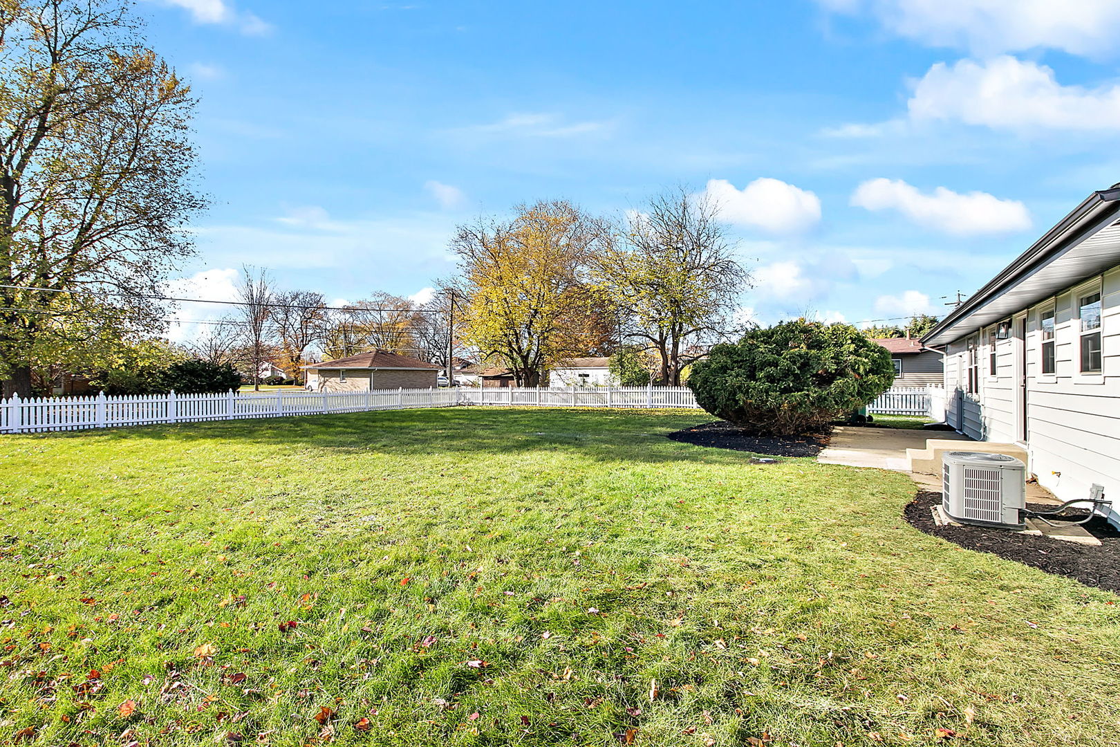 23519 West Renwick Road Plainfield, IL 60586 - Photo 17 of 22 a view of a fountain in front of a house with a big yard